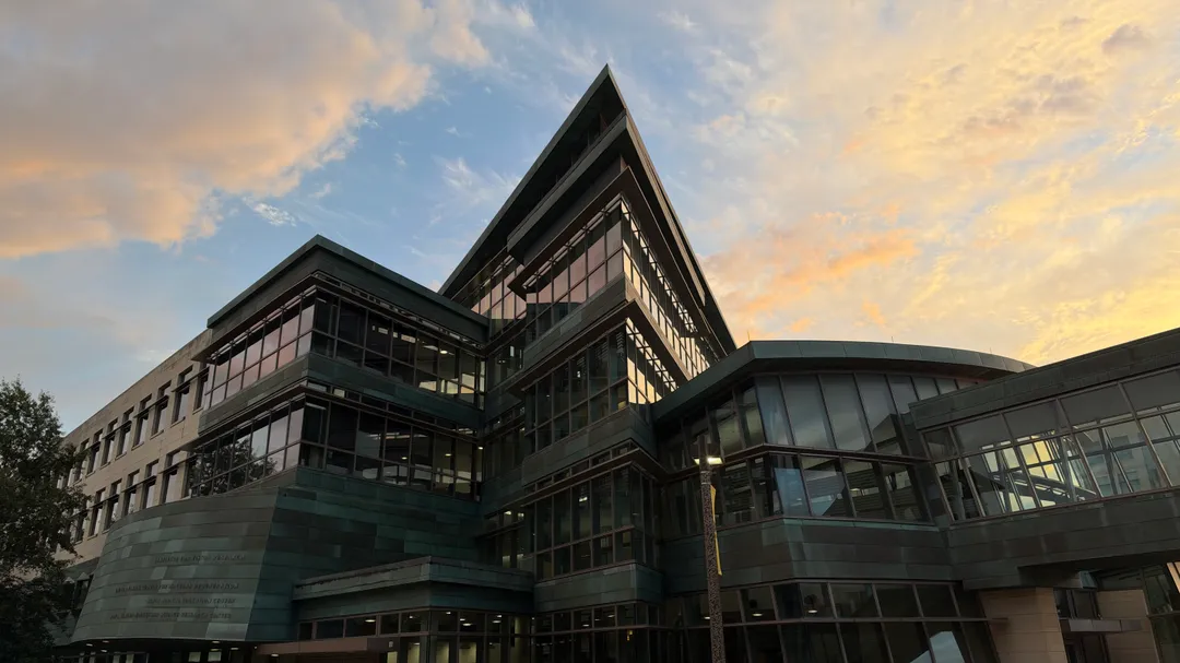 MERF building in front of a rising sun